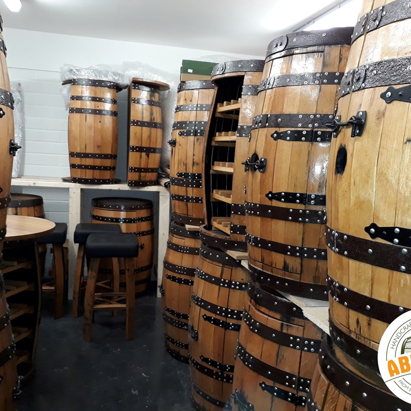 abywell finished whiskey barrels which have been turned into wine racks