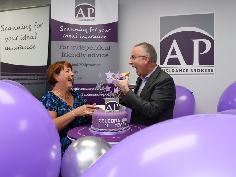 2 people celebrating with cake