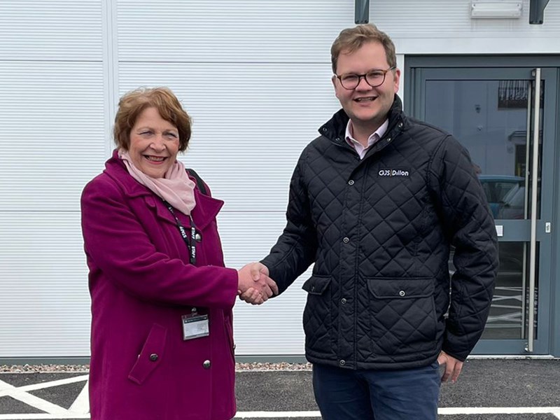 Image shows Councillor Mary Rayner and Andrew Lewis shaking hands in front of Silverwoods industrial unit