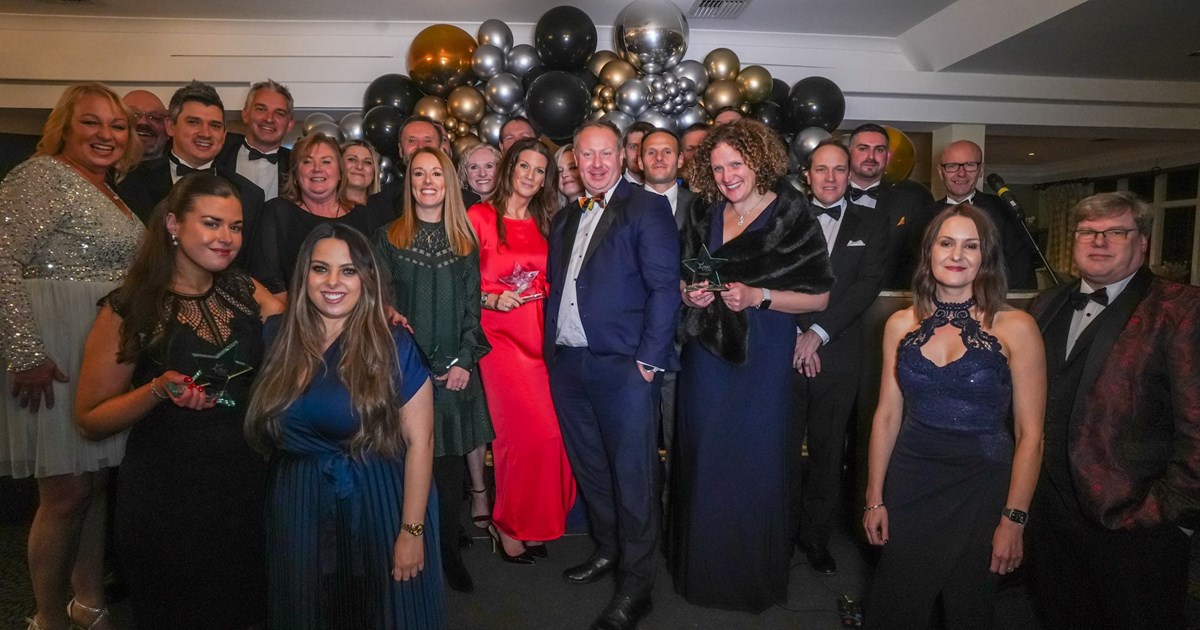 A group of people representing local business who have won awards at a ceremony.